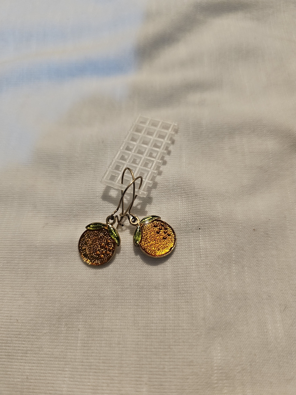 Gold-Orange Dangle Earrings with Green Leaf Detail